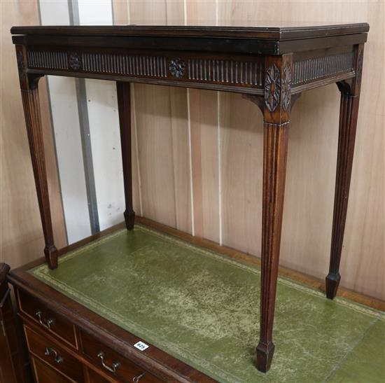 An Edwardian mahogany card table